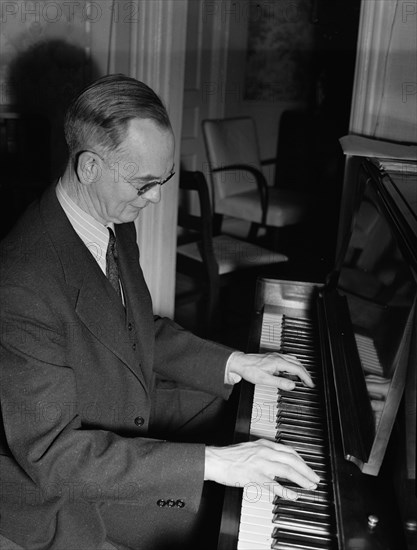 Portrait of Roy J. Carew in his home, 818 Quintana Place NW, Washington, D.C., ca. Feb. 1942. Creator: William Paul Gottlieb.