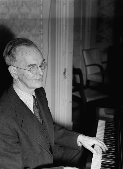 Portrait of Roy J. Carew in his home, 818 Quintana Place NW, Washington, D.C., ca. Feb. 1942. Creator: William Paul Gottlieb.