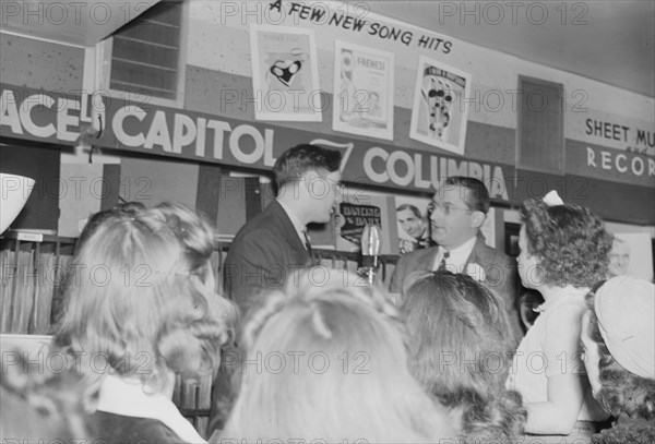 Portrait of Tommy Dorsey and William P. Gottlieb, record store, Washington, D.C., ca. 1940. Creator: Delia Potofsky Gottlieb.