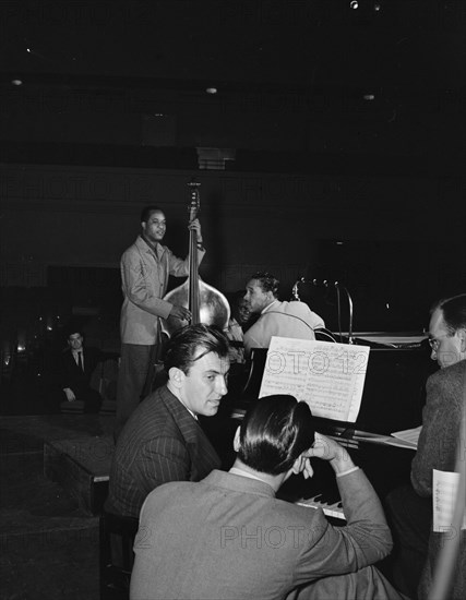 Portrait of Eddy Duchin, Wesley Prince, Nat King Cole, and Oscar Moore, New York, ca. July 1946. Creator: William Paul Gottlieb.