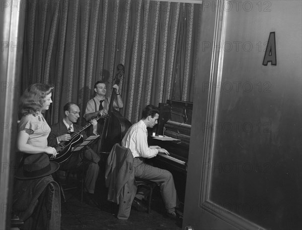 Portrait of Helen Carr, Sammy Herman, Joe Bianco, and Donn Trenner, Nola's, N.Y., ca. Feb. 1947. Creator: William Paul Gottlieb.