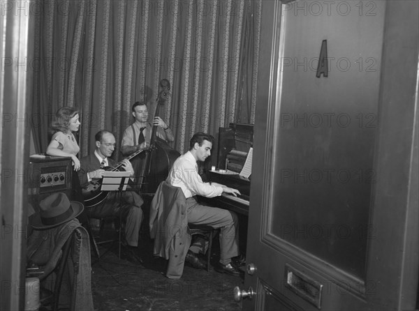 Portrait of Helen Carr, Sammy Herman, Joe Bianco, and Donn Trenner, Nola's, N.Y., ca. Feb. 1947. Creator: William Paul Gottlieb.