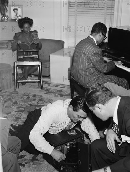 Portrait of Mary Lou Williams, Dizzy Gillespie, Jack...Mary Lou Williams' apartment, N.Y., 1947. Creator: William Paul Gottlieb.