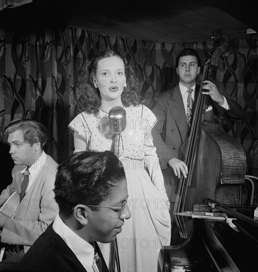 Portrait of Deryk Sampson, Lynn Carver, Justin Arndt, and Clair Dorward, Famous Door, N.Y., 1947. Creator: William Paul Gottlieb.