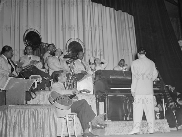 Portrait of Duke Ellington, Junior Raglin, Juan Tizol...Howard Theater(?), Washington, D.C., 1938. Creator: William Paul Gottlieb.