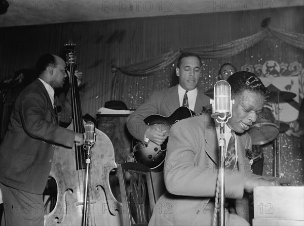 Portrait of Wesley Prince, Oscar Moore, and Nat King Cole, Zanzibar, New York, N.Y., ca. July 1946. Creator: William Paul Gottlieb.