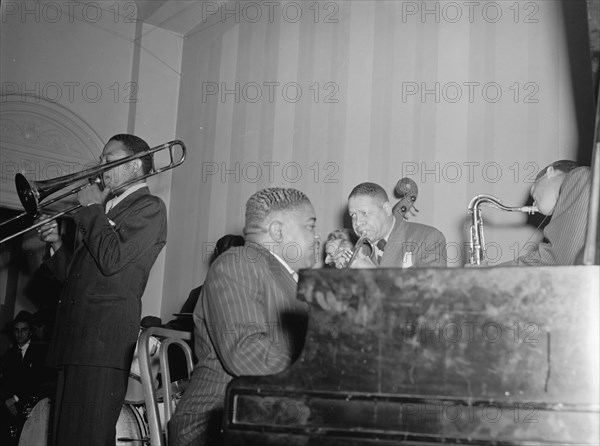 Portrait of Jay Higginbotham, Pete Johnson, Henry Allen, and Lester Young... Washington, D.C., c1940 Creator: William Paul Gottlieb.