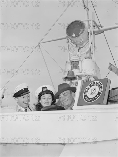 Portrait of Cliff Edwards, Betty Brewer, and Frank...Ukelele Lady (yacht), Hudson River, N.Y., 1947. Creator: William Paul Gottlieb.