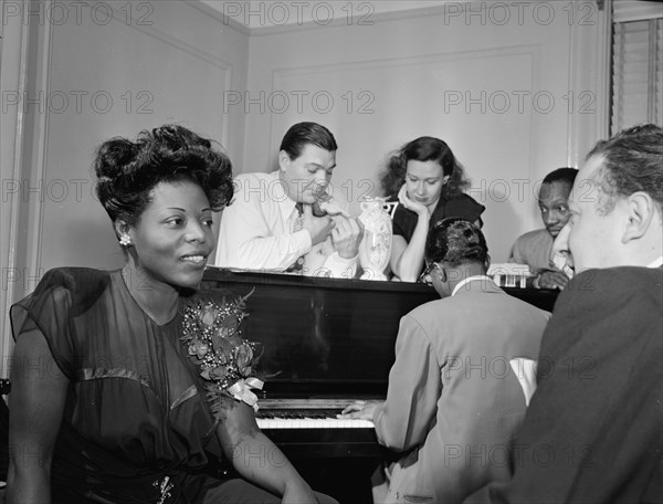 Portrait of Mary Lou Williams, Jack Teagarden, Dixie Bailey...Mary Lou Williams' apartment, NY, 1947 Creator: William Paul Gottlieb.