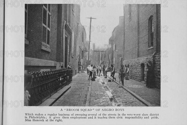 A "broom squad" of Negro boys; Which makes a regular business of sweeping several of the..., 1908. Creators: Unknown, Doubleday Page and Company.