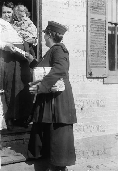 Mrs. Parmlee Campbell, Woman Mail Carrier - Delivering Mail..., 1917 Creator: Harris & Ewing.