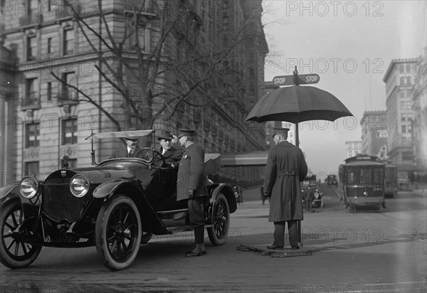 District of Columbia; Traffic. Stop And Go Signs, 1913. Creator: Harris & Ewing.