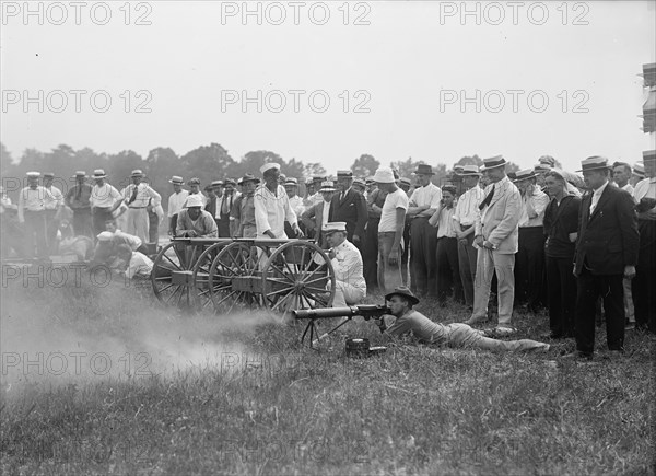 Marine Corps Rifle Range, Winthrop, Md. - Gen. Barnett Testing Colt's Automatic Machine Gun, 1917. Creator: Harris & Ewing.