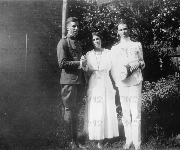 Mrs. Abby Scott Baker And Sons, 1917 or 1918. Creator: Harris & Ewing.