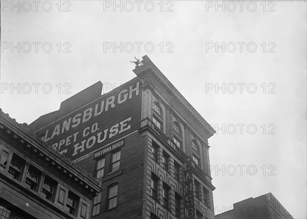 J. Reynolds, Performing Acrobatic And Balancing Acts On High Cornice Above 9th Street, N.W., 1917. Creator: Harris & Ewing.