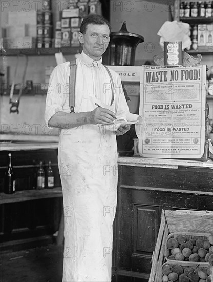 Store Interior - 'Waste No Food', 1917 or 1918. Creator: Harris & Ewing.