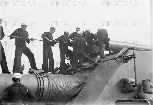 Target Practice - Cleaning 12' Gun, 1913. Creator: Unknown.