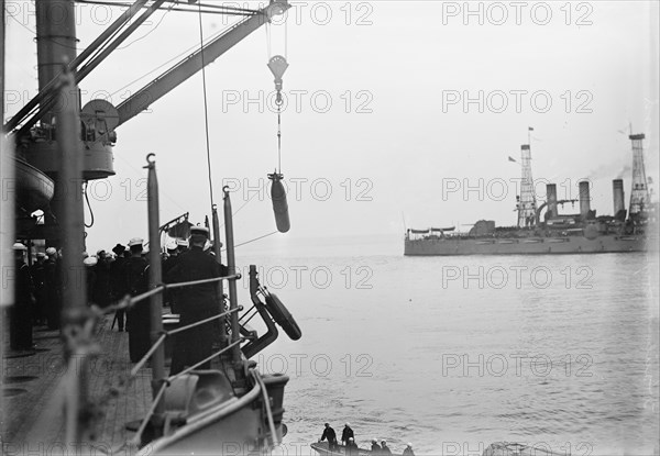 Target Practice - Hauling Torpedoes On Board, 1913. Creator: Unknown.
