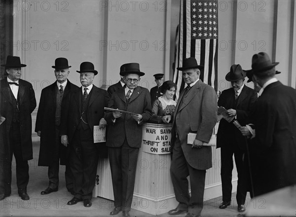 Thomas Riley Marshall, John Austin Moon, Champ Clark Buying War Savings And Thrift Stamps, 1918. Creator: Harris & Ewing.