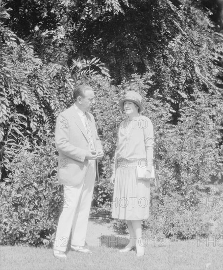 Alanson, Bertram, Mr. and Mrs., standing outdoors, between 1927 and 1937. Creator: Arnold Genthe.