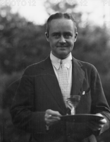 Dunning, Mr., standing outdoors, 1925 July 9. Creator: Arnold Genthe.