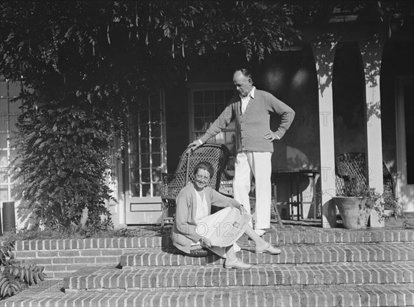 King, Hamilton, Mr. and Mrs., seated on the steps of their home, 1932 or 1933. Creator: Arnold Genthe.