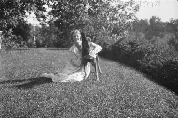 Robins, Miss, with dog, outdoors, 1918 Feb. 16. Creator: Arnold Genthe.