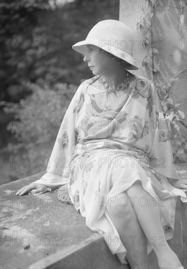 Stettheimer, Florine, Miss, seated outdoors, 1931 Aug. 19. Creator: Arnold Genthe.