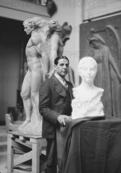 Patigian, Haig, Mr., with his sculptures, portrait photograph, 1927 Creator: Arnold Genthe.