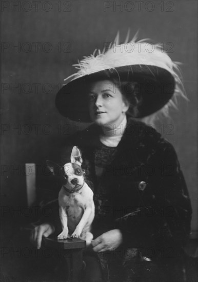 Brooks, Anita, Miss, with dog, portrait photograph, 1917 or 1918. Creator: Arnold Genthe.