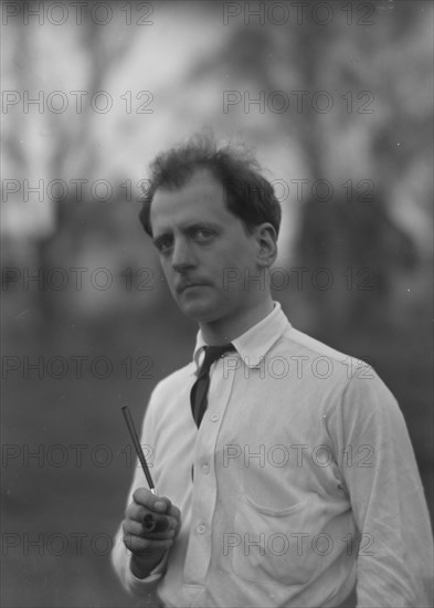 Kennerley, Mitchell, Mr., standing outdoors, 1914 or 1915. Creator: Arnold Genthe.