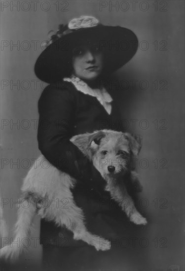 Taylor, Laurette, Miss, with dog, portrait photograph, 1913. Creator: Arnold Genthe.