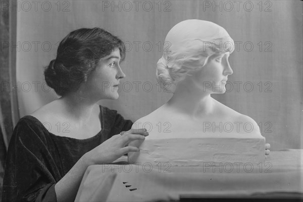 Woodruff, Eleanor, Miss, with portrait bust, portrait photograph, ca. 1914. Creator: Arnold Genthe.