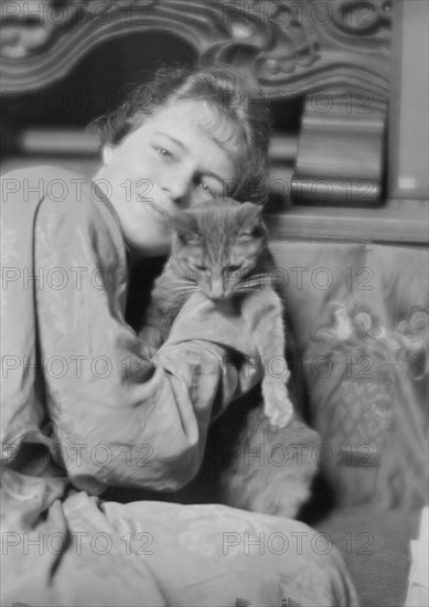 Cutler, Miss, with Buzzer the cat, portrait photograph, 1915 May 26. Creator: Arnold Genthe.