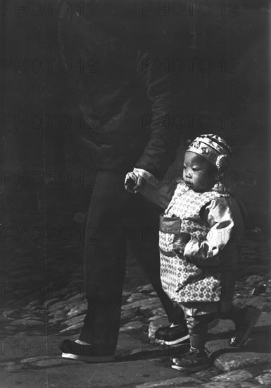 A Chinese boy, Chinatown, San Francisco, between 1896 and 1906. Creator: Arnold Genthe.