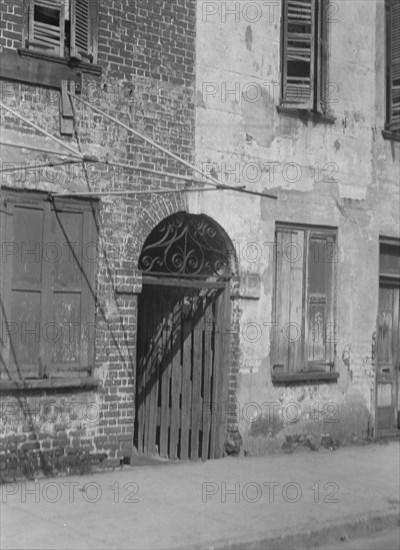 Facades of multi-story buildings, New Orleans or Charleston, South Carolina, between 1920 and 1926. Creator: Arnold Genthe.