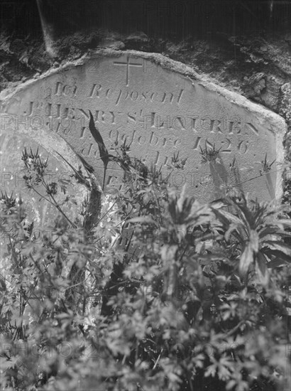 Tombstone in St. Louis Cemetery, New Orleans, between 1920 and 1926. Creator: Arnold Genthe.