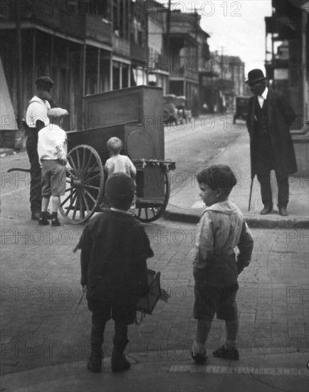 Organ grinder, New Orleans, between 1920 and 1926. Creator: Arnold Genthe.