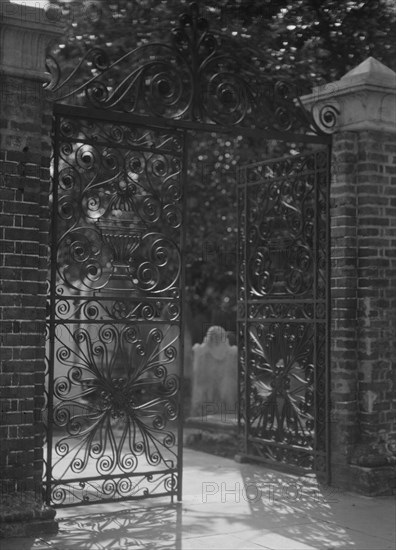 Gates on Broad Street to the graveyard at St. Michael's Episcopal Church, Charleston..., c1920-1926. Creator: Arnold Genthe.