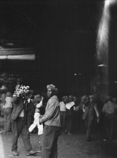 Unloading bananas, New Orleans, between 1920 and 1926. Creator: Arnold Genthe.