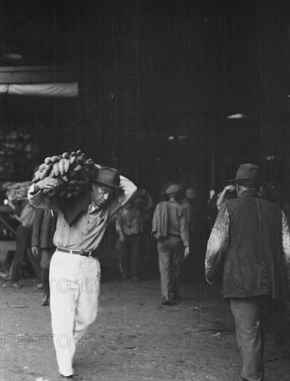 Unloading bananas, New Orleans, between 1920 and 1926. Creator: Arnold Genthe.