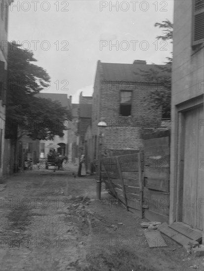 Street scene, New Orleans or Charleston, South Carolina, between 1920 and 1926. Creator: Arnold Genthe.