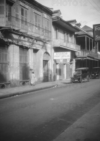 View down a street, New Orleans, between 1920 and 1926. Creator: Arnold Genthe.