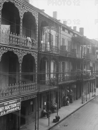 View down a street, New Orleans, between 1920 and 1926. Creator: Arnold Genthe.