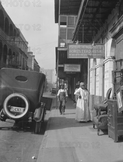 View down a street, New Orleans, between 1920 and 1926. Creator: Arnold Genthe.