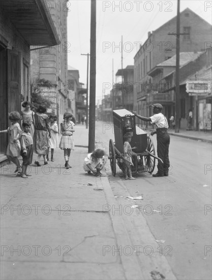 Organ grinder, New Orleans, between 1920 and 1926. Creator: Arnold Genthe.