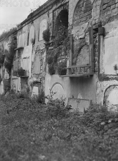 Wall tombs of the old St. Louis Cemetery, New Orleans, between 1920 and 1926. Creator: Arnold Genthe.