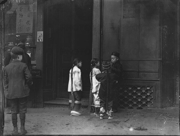 His first cigar, Chinatown, San Francisco, between 1896 and 1906. Creator: Arnold Genthe.