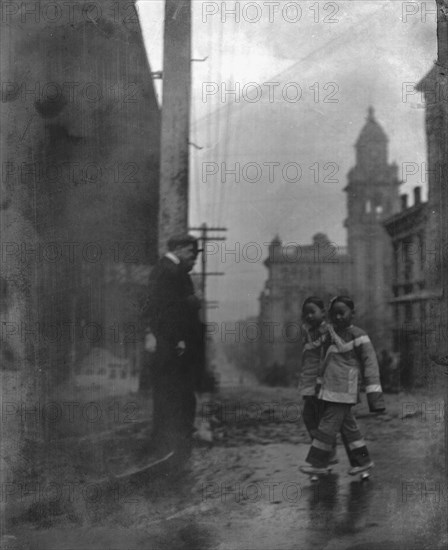 Two little maids from school, Chinatown, San Francisco, between 1896 and 1906. Creator: Arnold Genthe.