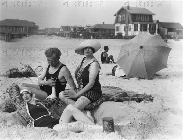 Arnold Genthe with two women friends in Long Beach, New York, between 1911 and 1942. Creator: Arnold Genthe.